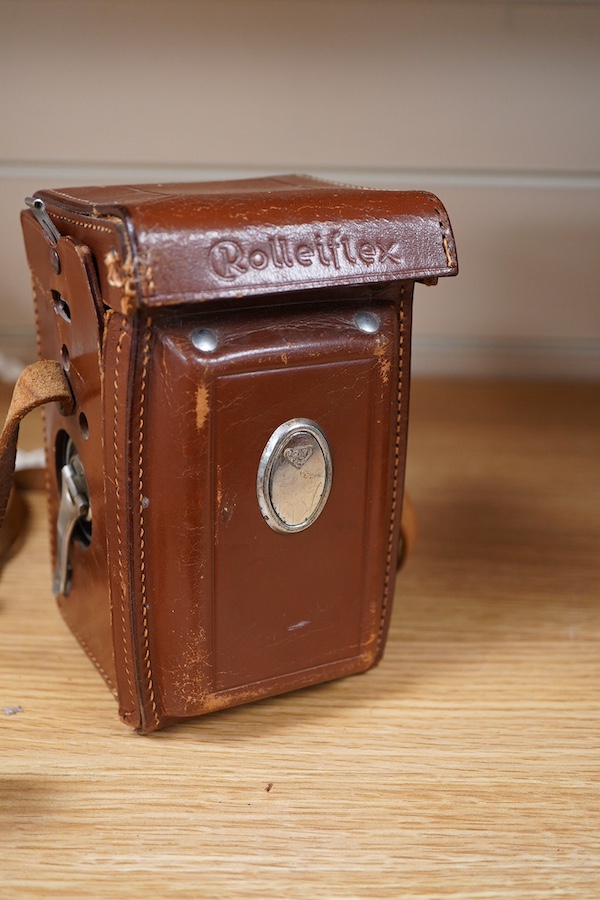 A mid 20th century German Franke & Heidecke Rolleiflex twin lens reflex camera in its original fitted leather case